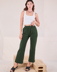 Alex is 5'8" and wearing P Easy Western Pants in Swamp Green