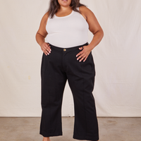 Alicia is 5'9" and wearing 2XL Western Pants in Basic Black paired with a vintage off-white Tank Top