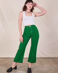 Alex is 5'8" and wearing XS Western Pants in Forest Green paired with a Cropped Tank in Vintage Tee Off-White