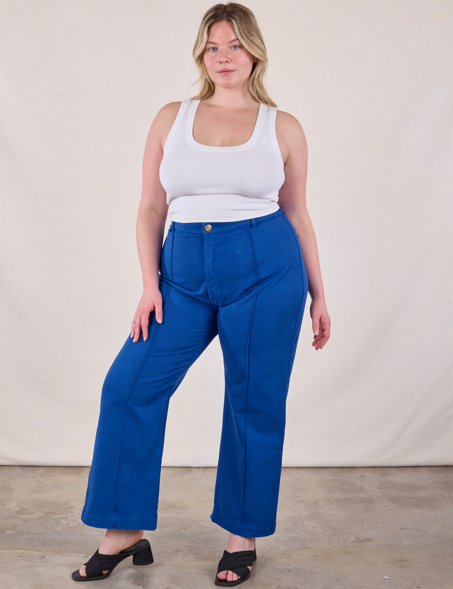 Lish is 5&#39;8&quot; and wearing XL Western Pants in Royal Blue paired with a Cropped Tank in Vintage Tee Off-White