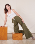 Alex is wearing Wide Leg Sweat Pants in Surplus Green and Cropped Tank in vintage tee off-white