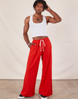 Jerrod is 6'3" and wearing S Wide Leg Sweat Pants in Mustang Red paired with Cropped Tank in vintage tee off-white