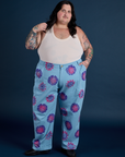 Sam is 5’10” and wearing 4XL Floral Painted Work Pants in Blue paired with a Tank Top in Vintage Tee Off-White