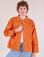 Quinn is 6'4" and wearing L Denim Work Jacket in Construction Orange