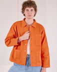 Quinn is 6'4" and wearing L Denim Work Jacket in Construction Orange