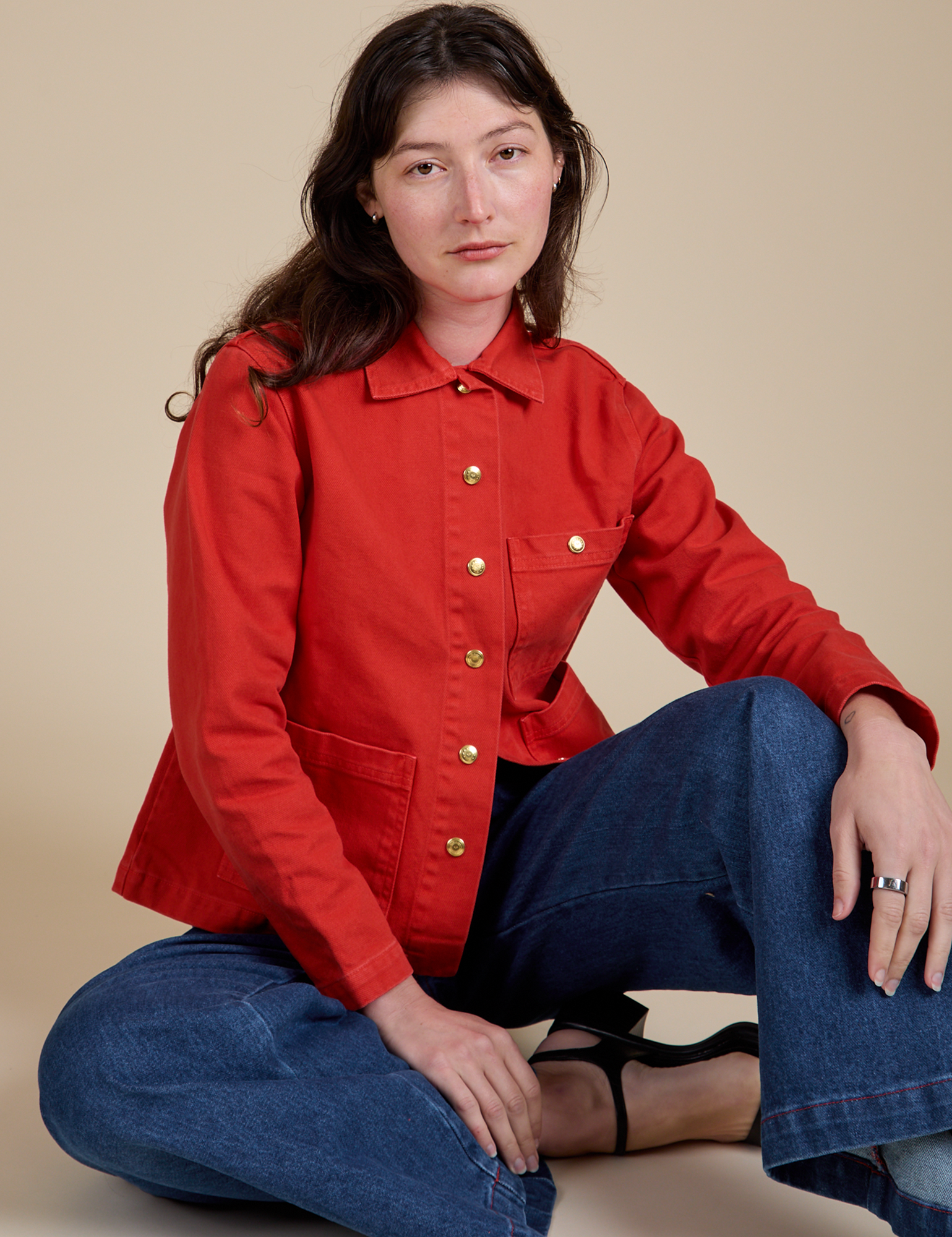 Alex is wearing Denim Work Jacket in Mustang Red