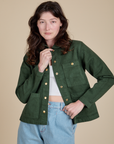 Alex is 5'8" and wearing P Denim Work Jacket in Swamp Green