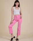 Alex is 5’8” and wearing XS Work Pants in Bubblegum Pink paired with a vintage tee white Cropped Tank