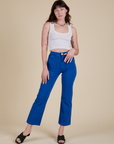Alex is 5’8” and wearing XS Work Pants in Royal Blue paired with a vintage tee white Cropped Tank