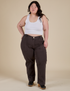 Ashley is 5’7” and wearing 1XL Work Pants in Espresso Brown paired with a vintage tee white Cropped Tank