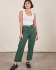 Soraya is 5'2" and wearing Petite XXS Work Pants in Dark Emerald Green paired with vintage off-white Tank Top