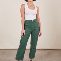 Soraya is 5'2" and wearing Petite XXS Work Pants in Dark Emerald Green paired with vintage off-white Tank Top