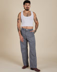 Jesse is 5’8” and wearing S Work Pants in Washed Grey paired with a Cropped Tank in Vintage Tee White