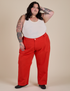 Sam is 5’10” and wearing 4XL Work Pants in Mustang Red paired with Cropped Tank in Vintage Tee White