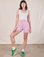 Alex is 5'8" and wearing XS Classic Work Shorts in Lilac Purple paired with a Cropped Tank in Vintage Tee Off-White