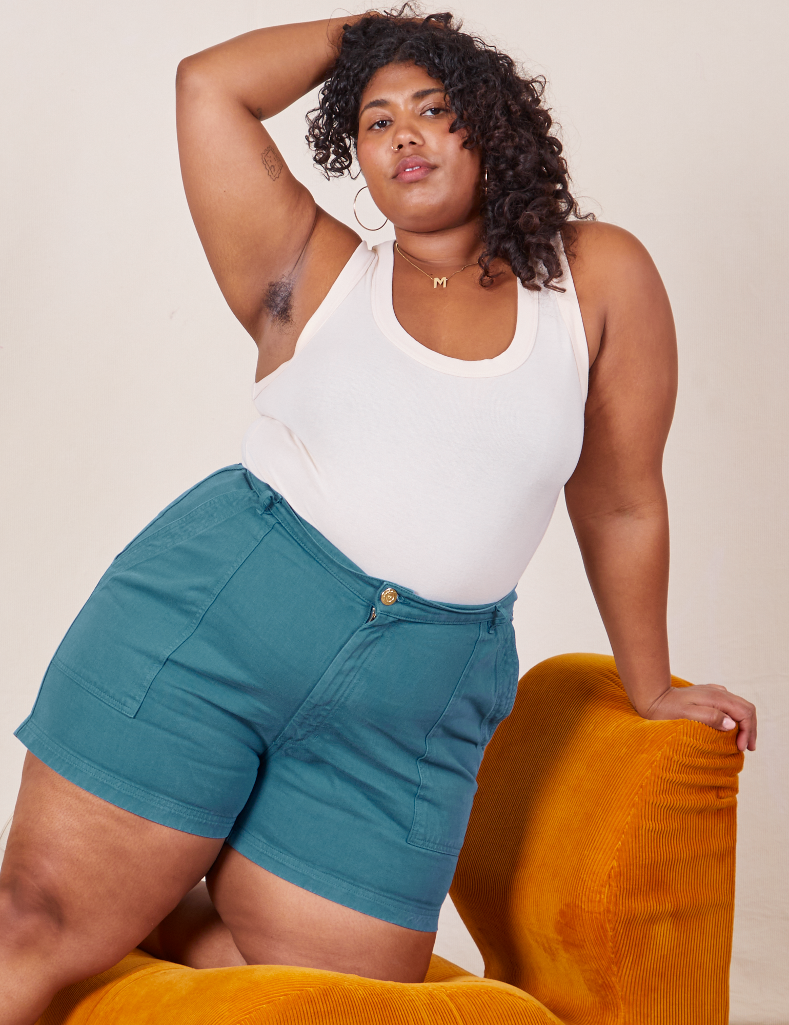 Morgan is 5’5” and wearing 1XL Classic Work Shorts in Marine Blue paired with a Tank Top in vintage tee off-white