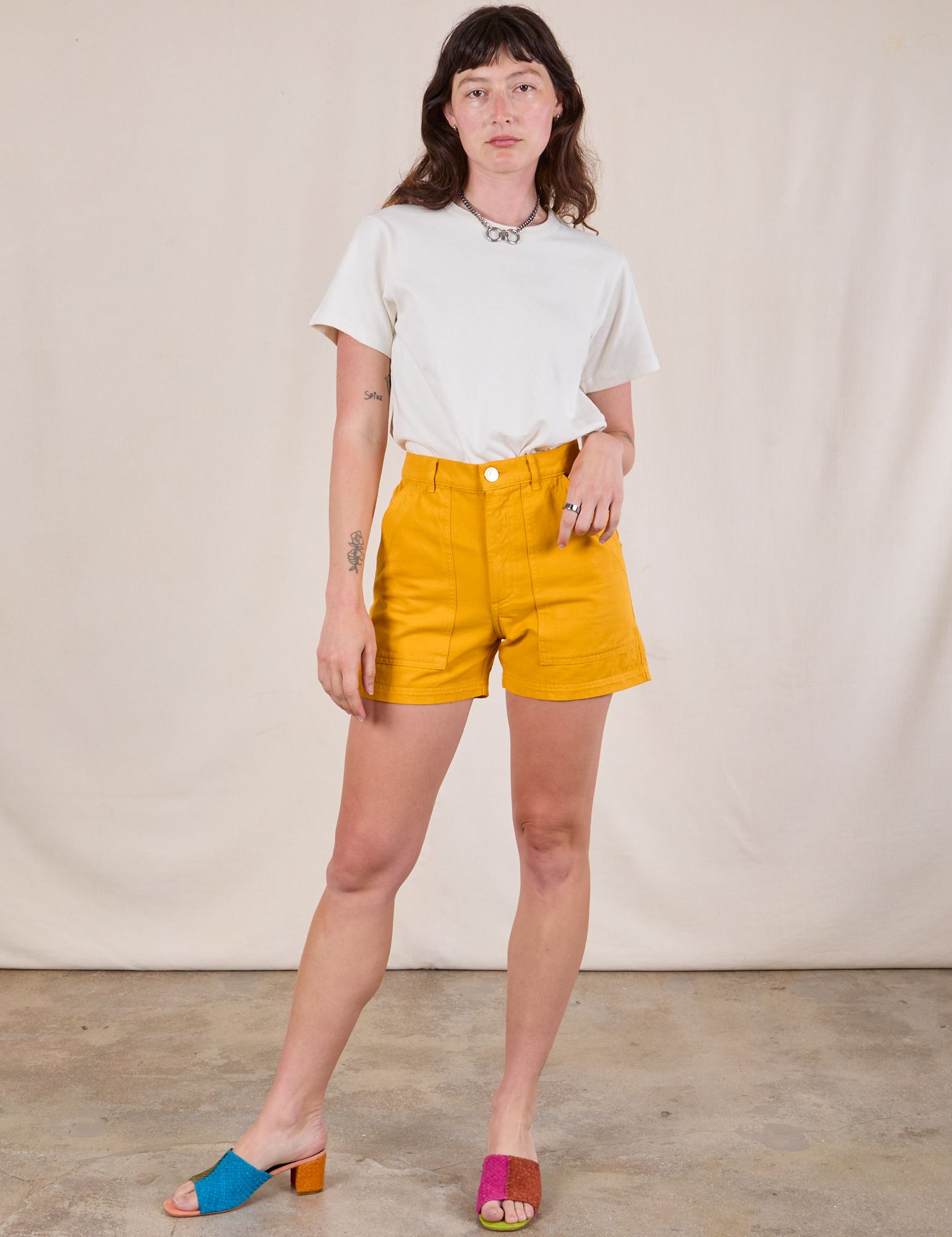 Alex is 5'8" and wearing XS Classic Work Shorts in Mustard Yellow