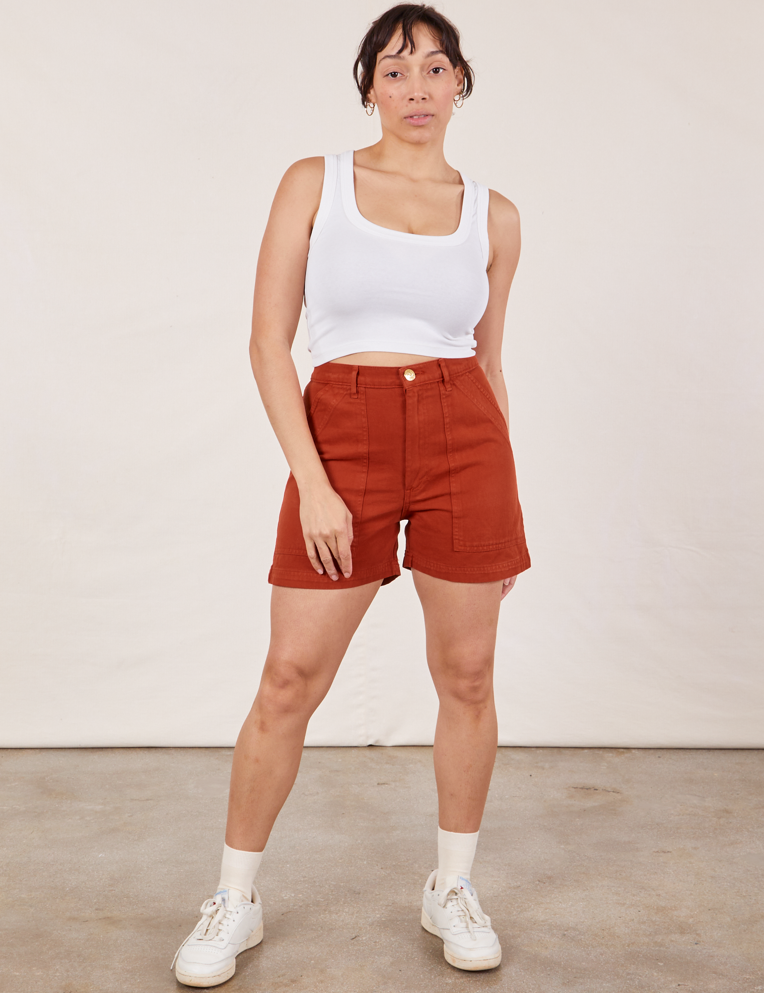Tiara is 5’4” and wearing S Classic Work Shorts in Paprika paired with Cropped Tank Top in vintage tee off-white