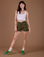 Alex is 5’8” and wearing XXS Classic Work Shorts in Surplus Green paired with a vintage off white Cropped Tank