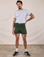Jesse is 5’8” and wearing XS Classic Work Shorts in Swamp Green paired with a Jr. Varsity Tee in Stone White
