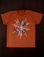 Vintage Tee in Spidey. Orange tee body with a black and white spider graphic.