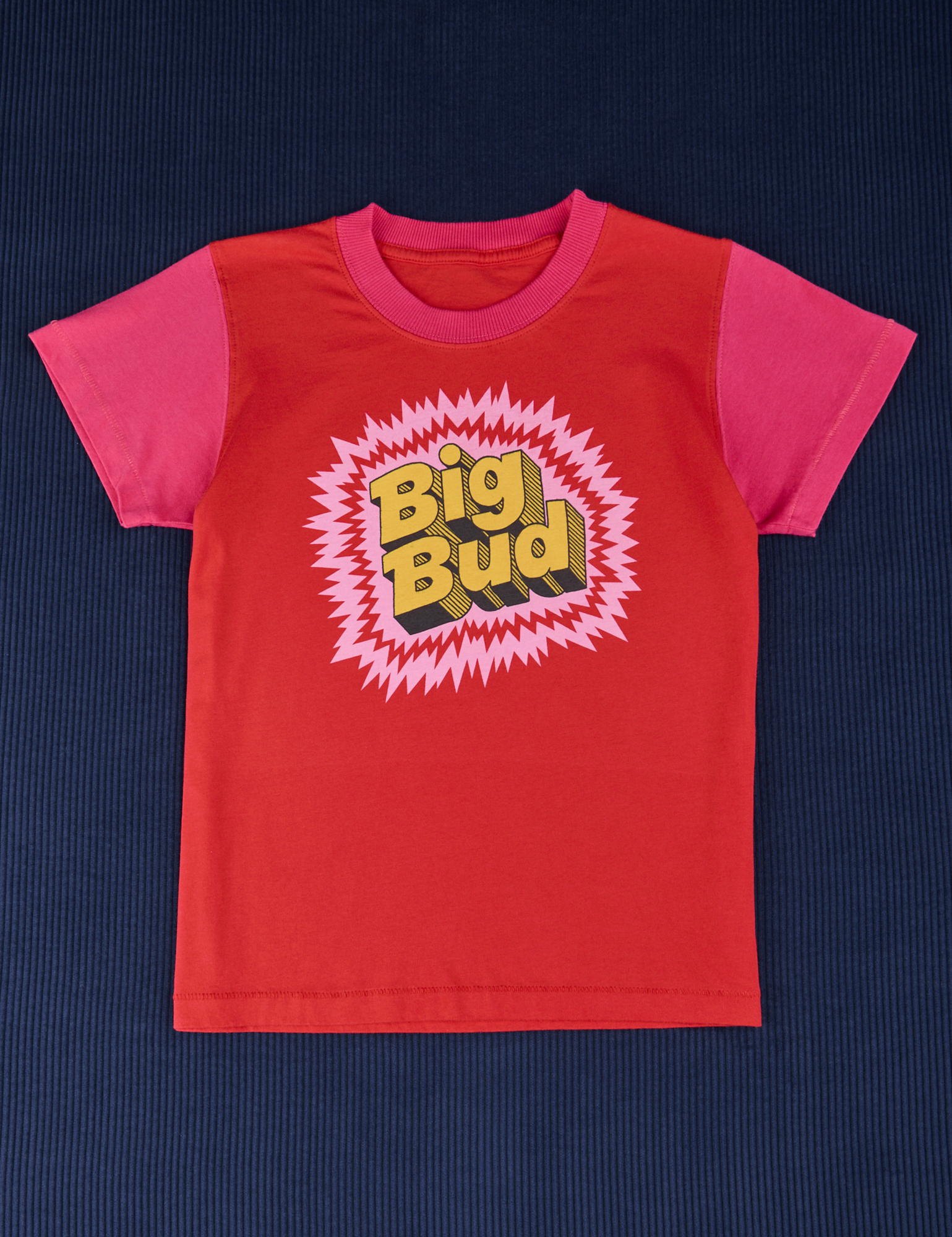 Vintage Tee in Pop Rocks Explosion. Mustang Red t-shirt body with hot pink sleeves. Big Bug in yellow text surrounded by pink and red.
