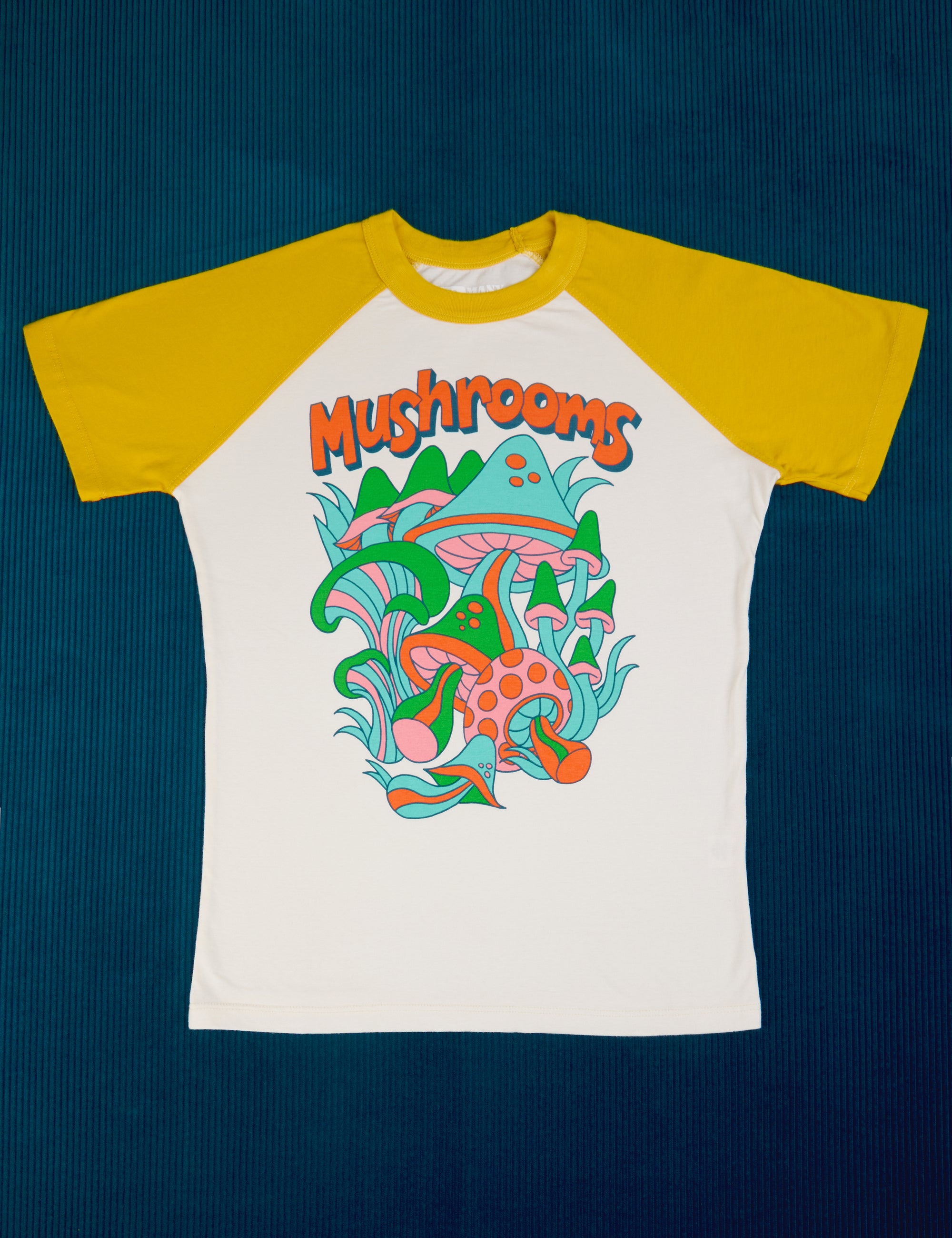 White body with yellow sleeves. Mushroom graphic at center of tee.