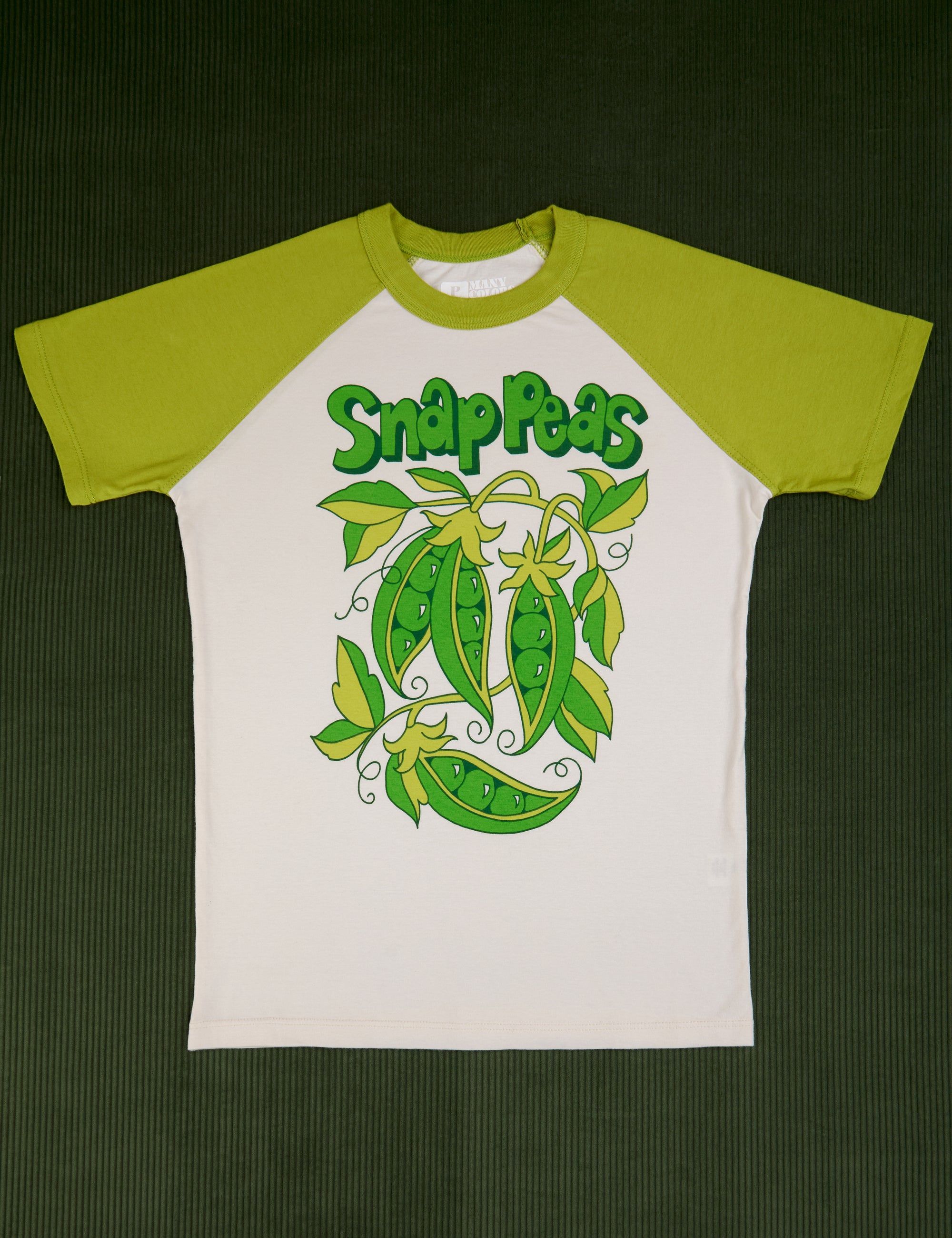 White tee body with gross green sleeves. Graphic of snap peas in the middle of the shirt.