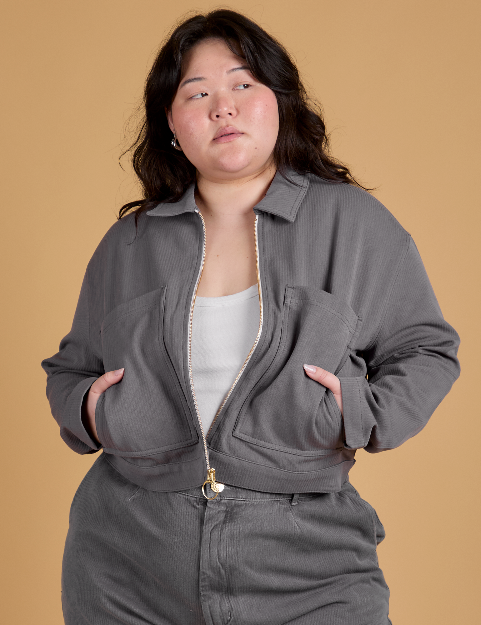 Ashley is 5’7” and wearing L Heritage Mechanic Jacket in Washed Grey