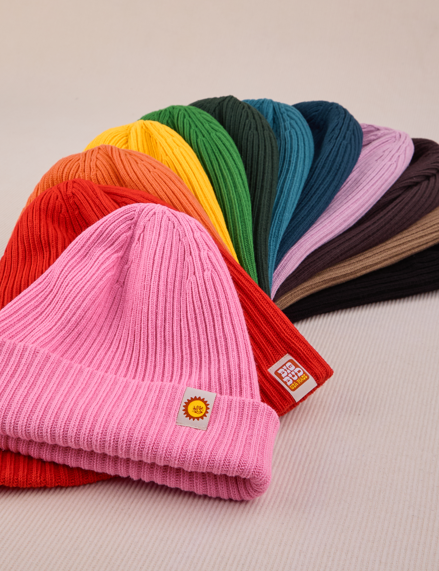 Ribbed Beanies fanned out in an array of colors