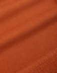 Action Pants in Burnt Terracotta fabric detail close up