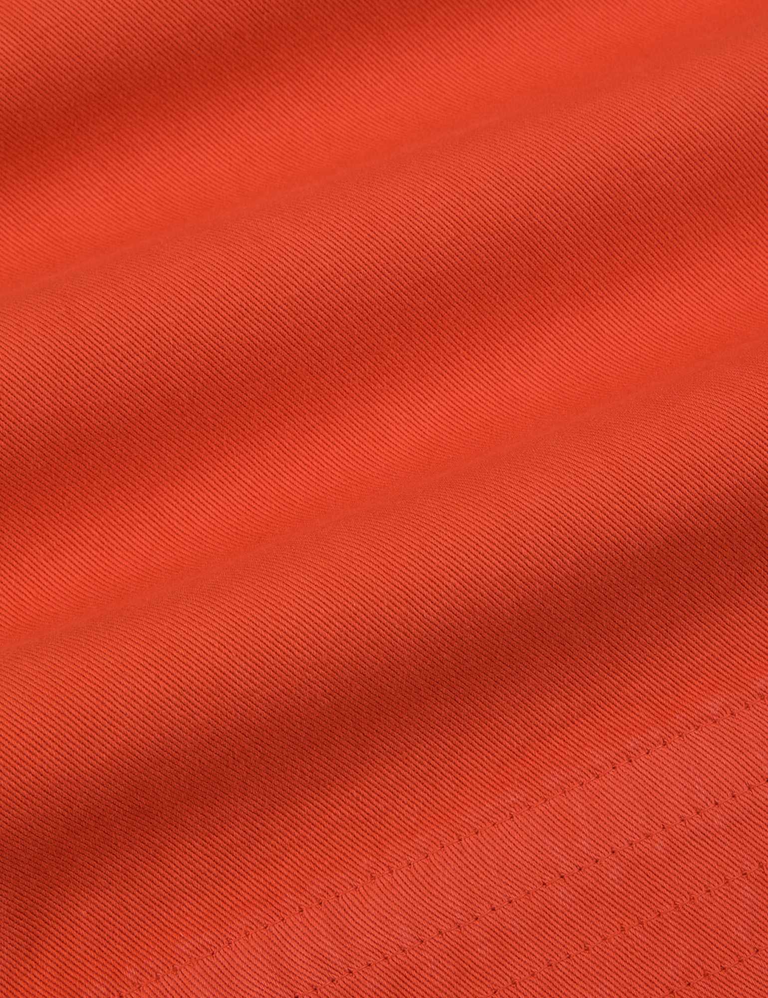 Action Pants in Chili Red fabric detail close up