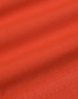 Action Pants in Chili Red fabric detail close up