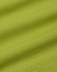 Action Pants in Gross Green fabric detail close up