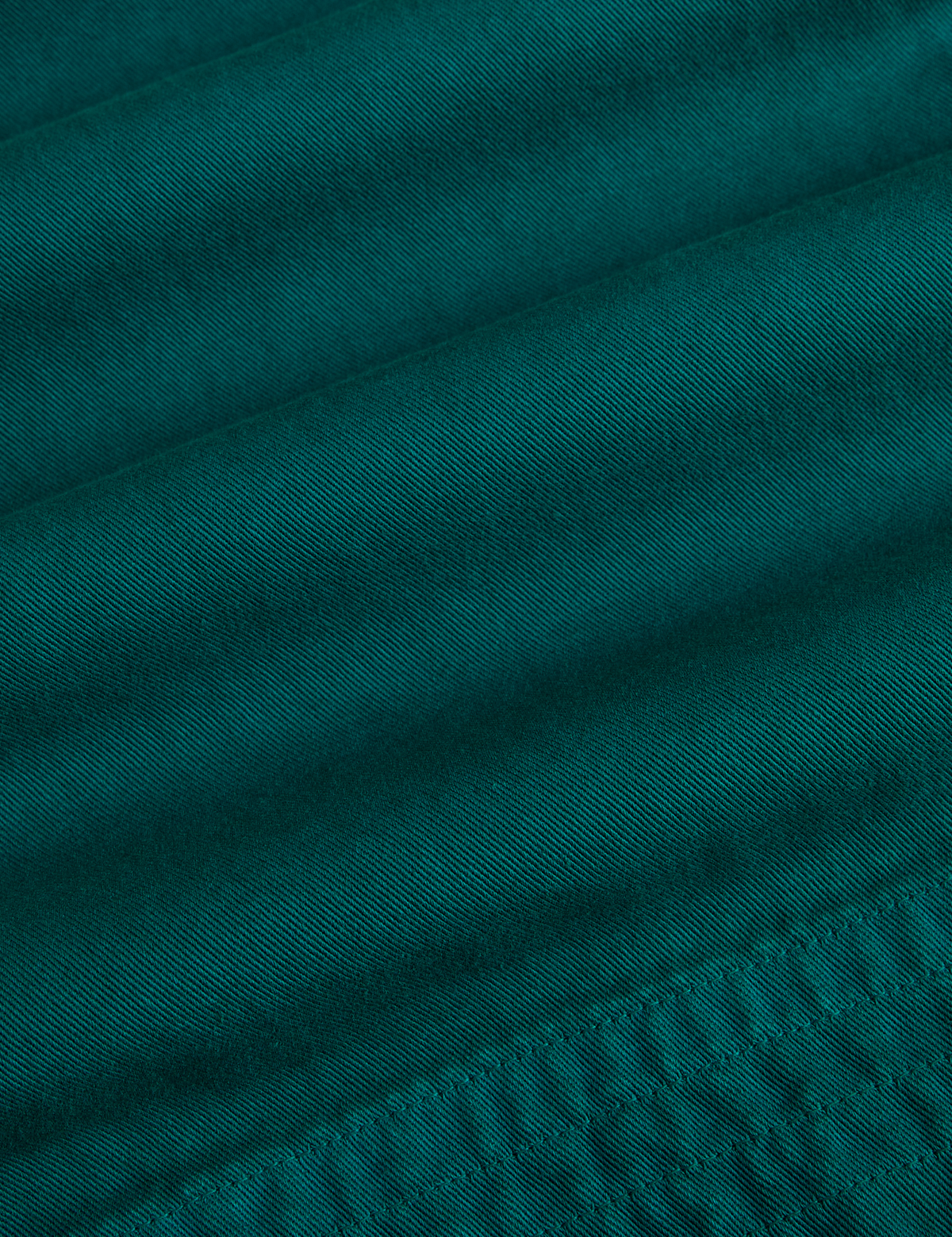 Fabric close up of the Hunter Green Action Pant