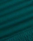 Fabric close up of the Hunter Green Action Pant