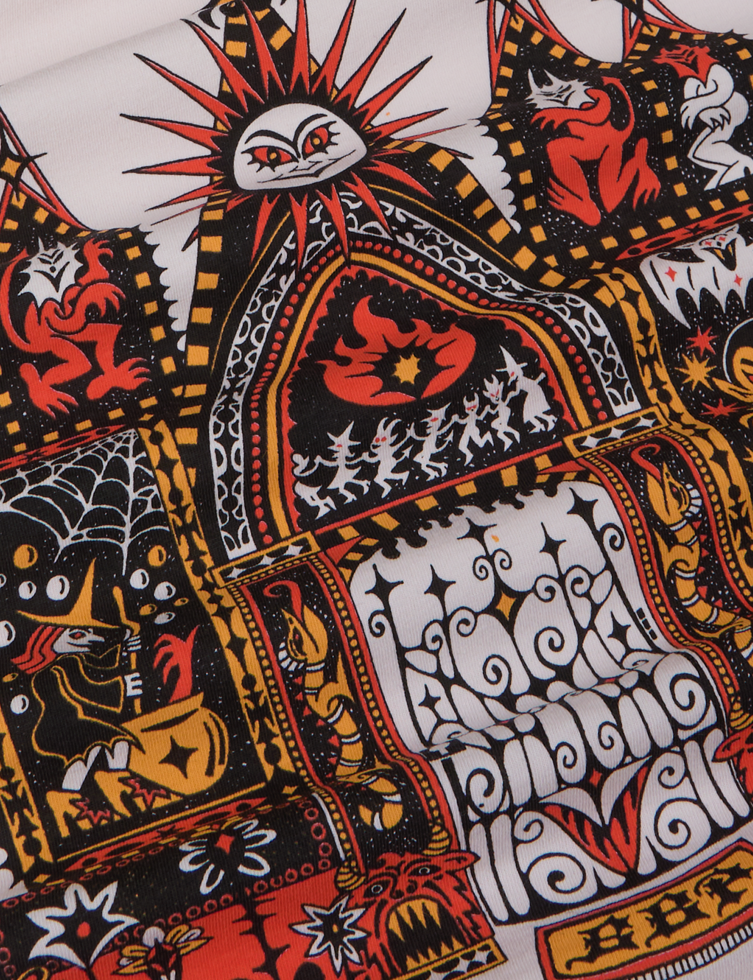 Close up of gates of hell graphic in black, red and yellow.