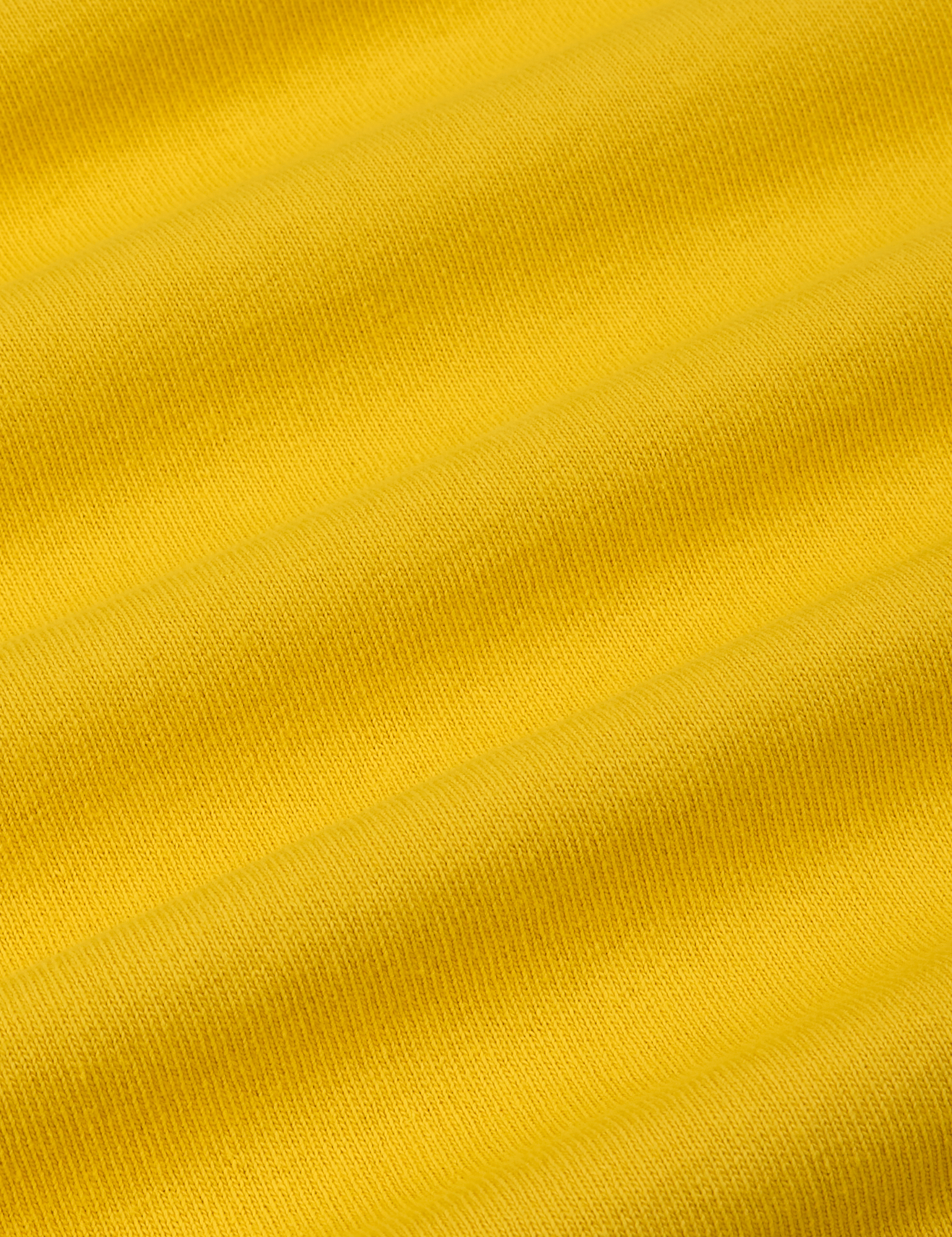 Burly Tee in Golden Yellow fabric detail close up