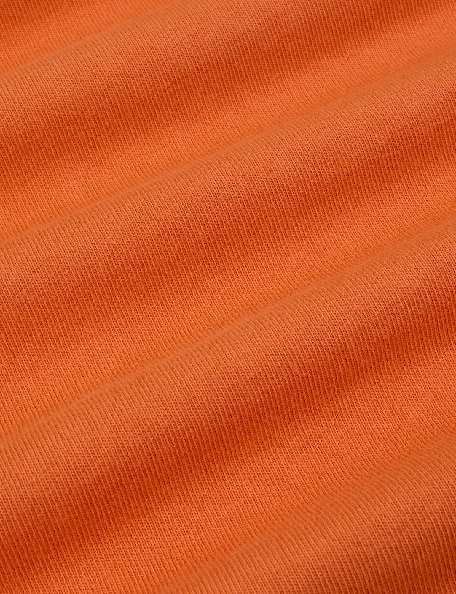 Burly Tee in Construction Orange fabric detail close up