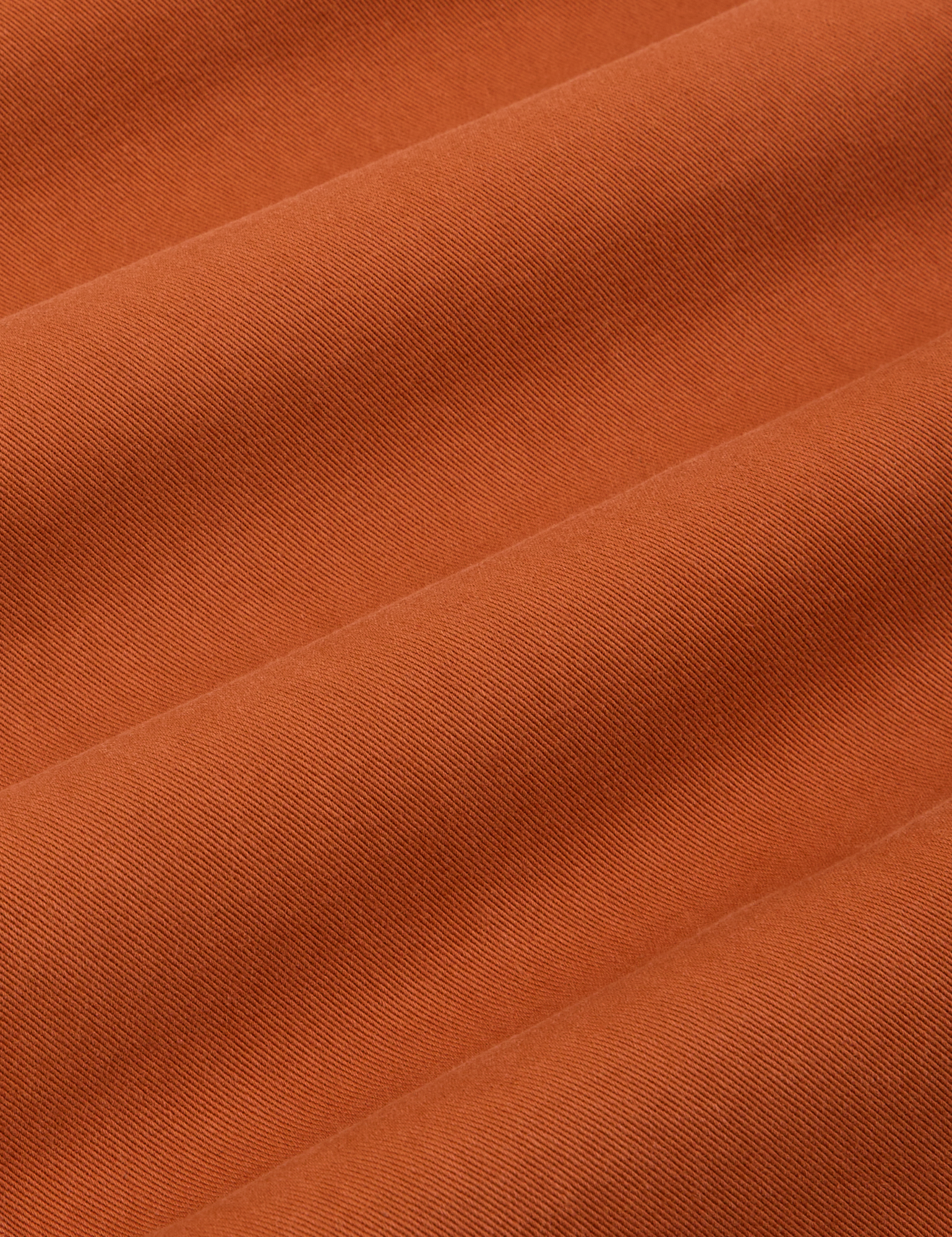 Bell Bottoms in Burnt Terracotta fabric detail close up