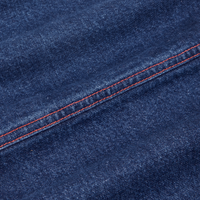 Carpenter Jeans in Dark Wash fabric detail close up with contrast red stitching.