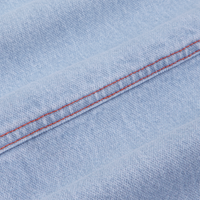 Carpenter Jeans in Light Wash fabric detail close up with red contrast stitching