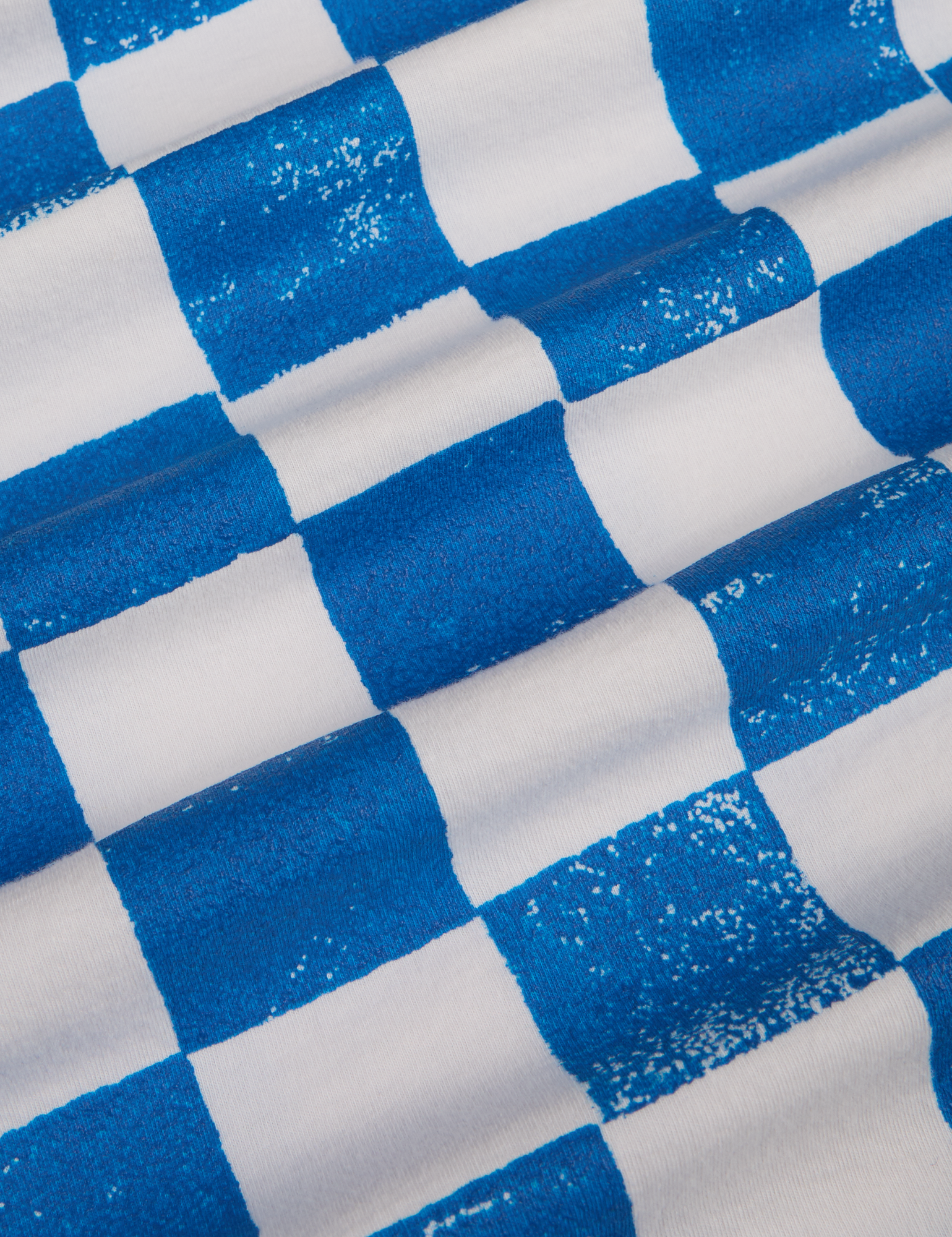 Fabric detail close up of blue and white checkerboard print