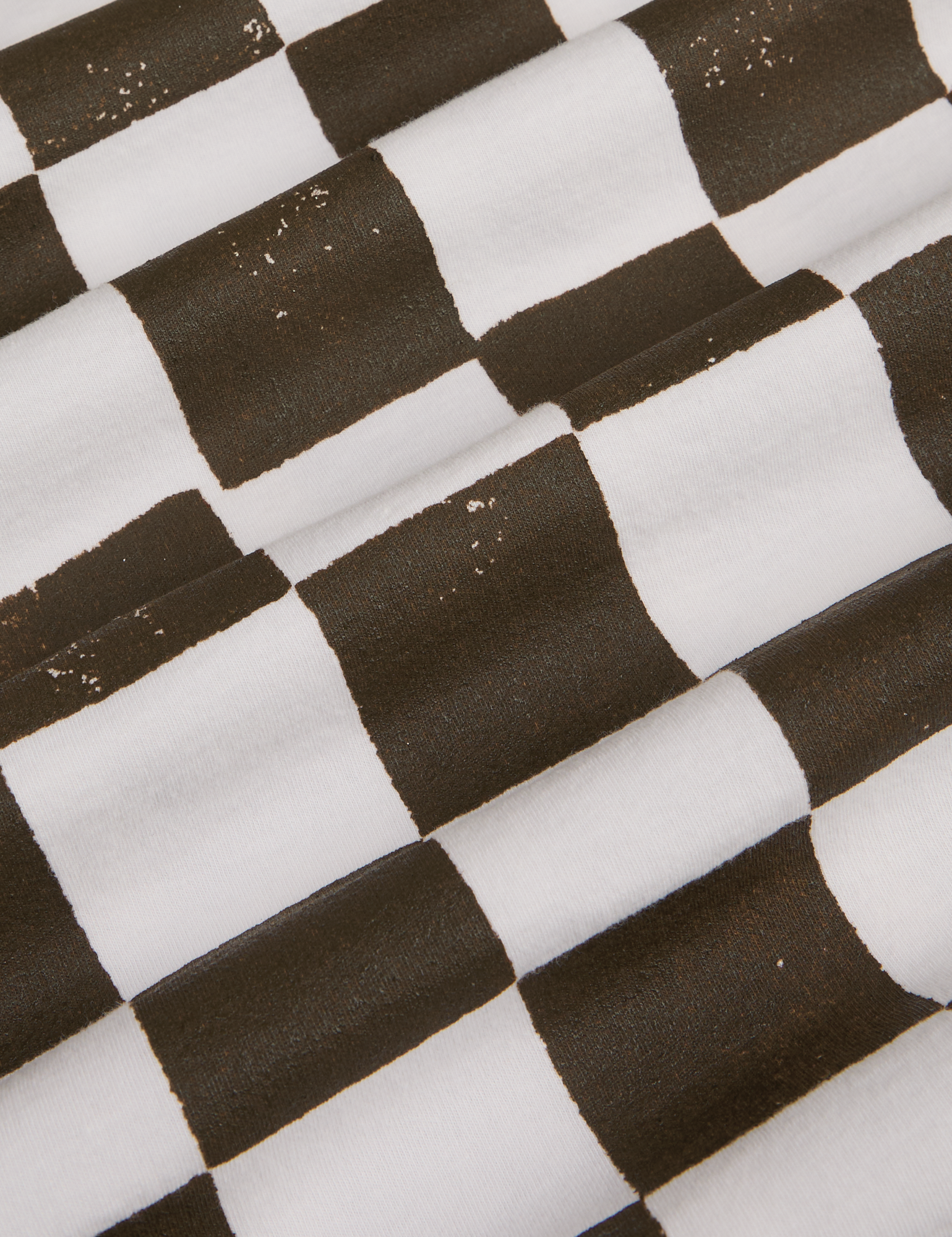 Fabric detail close up of espresso brown and white checkerboard print