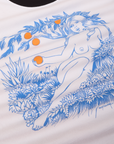 Vintage Tee in California Girl close up of illustration of naked woman holding an orange