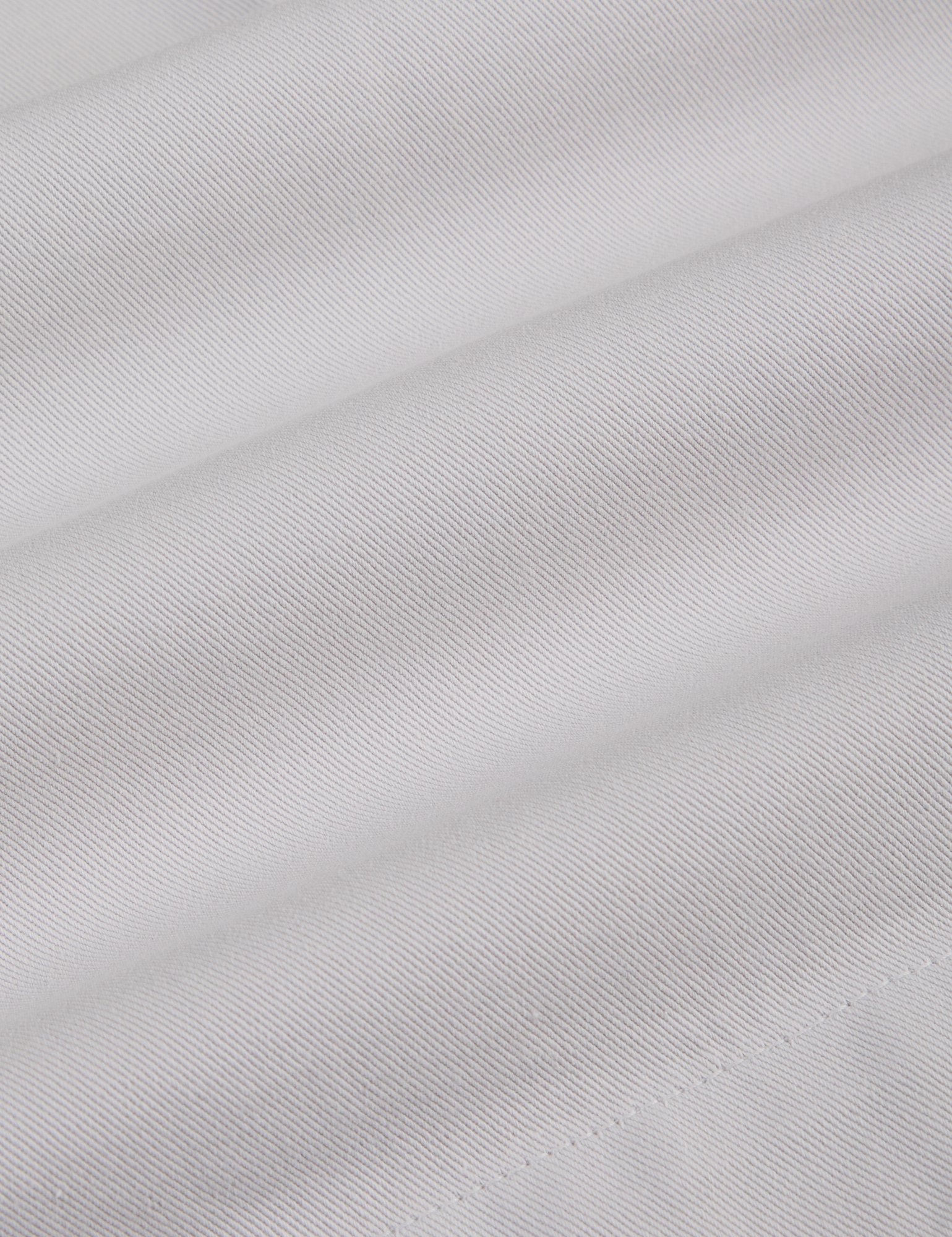 Pleated Trouser Shorts in Dishwater White fabric detail close up