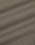 Pleated Trouser Shorts in Khaki Grey fabric detail close up