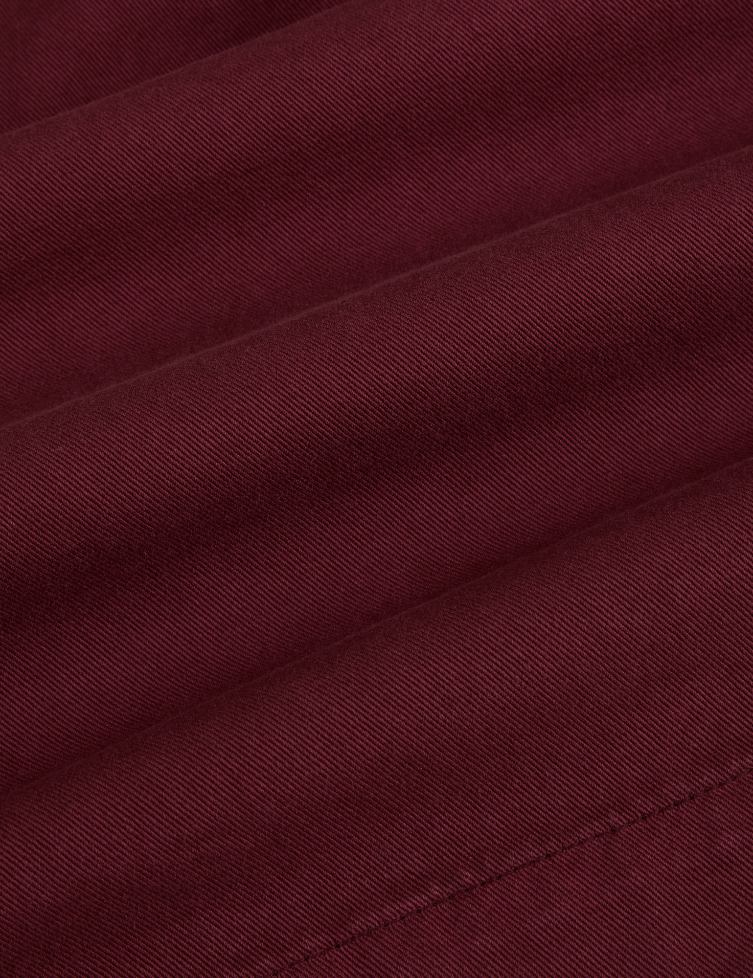 Pleated Trouser Shorts in Red Wine fabric detail close up