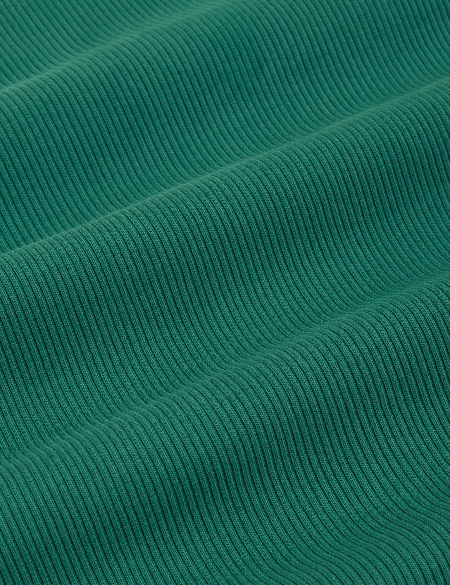 Essential Turtleneck in Hunter Green fabric detail close up