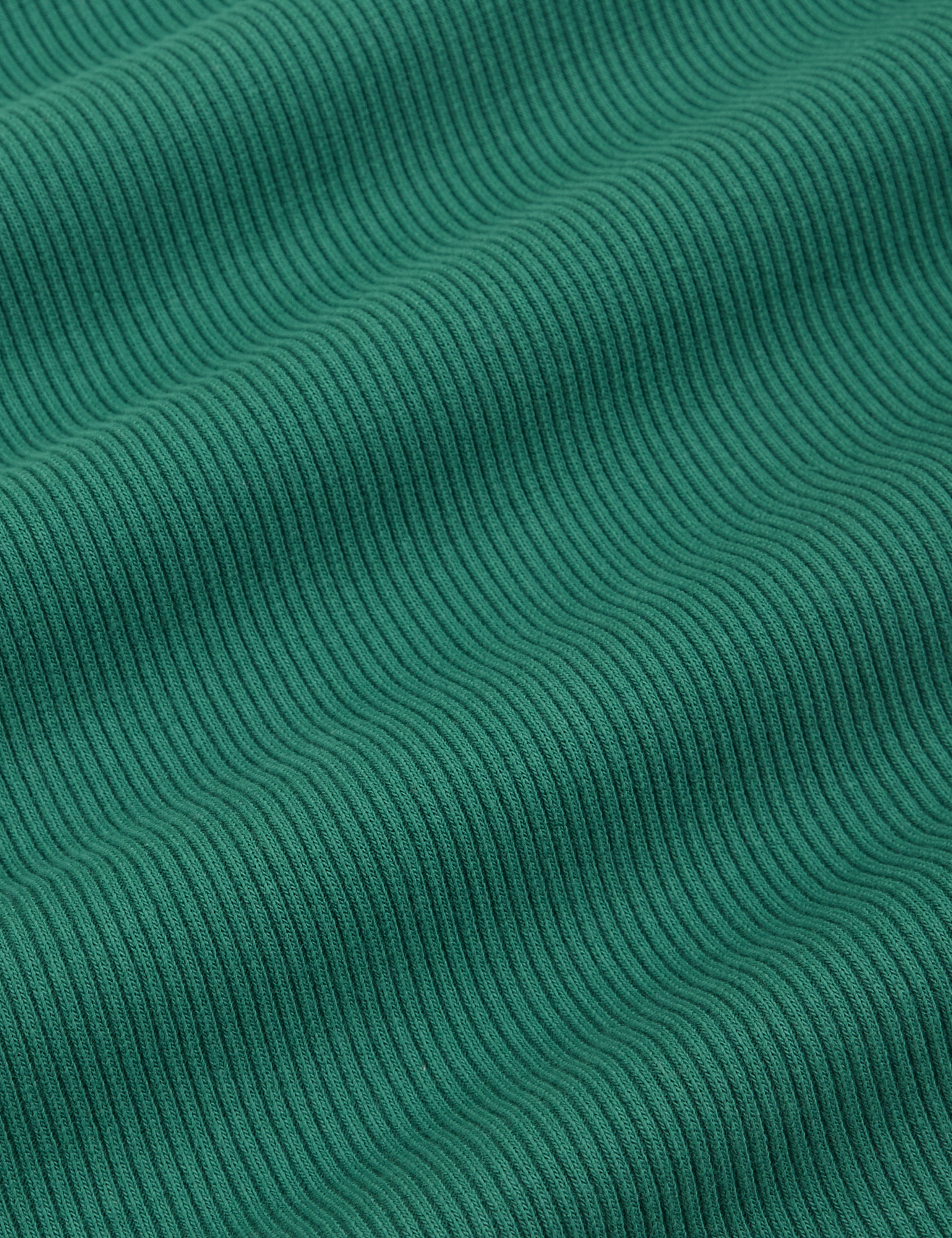 Sleeveless Essential Turtleneck in Hunter Green fabric detail close up
